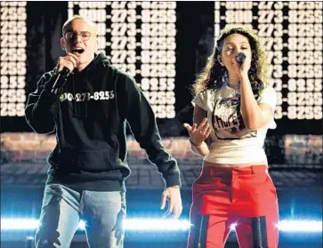  ?? Kevin Mazur Getty Images ?? RECORDING ARTISTS Logic and Alessia Cara perform Sunday night at 60th Grammy Awards in New York.