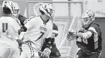  ?? AMY DAVIS/BALTIMORE SUN ?? Loyola Maryland’s Pat Spencer, preparing to shoot against Lehigh, has helped the Greyhounds improve their shooting percentage (. 301 to .359), shots on goal percentage (. 587 to .644) and goals per game (12.4 to 13.6) from a year ago.