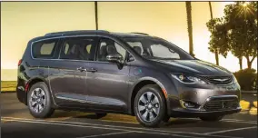  ?? PHOTO: CHRYSLER ?? The 2018 Chrysler Pacifica Hybrid comes with a long list of standard and available features, including state-of-the-art safety and connectivi­ty technology. A plug-in hybrid, the Pacifica can go up to 30 miles on battery power before recharging.