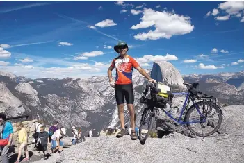  ?? COURTESY OF RUSS MCCOY ?? Russ McCoy stands by Glacier Point with a view of the Half Dome at Yosemite National Park, Calif., in the background.