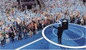  ?? MICHAEL CHOW, USA TODAY ?? President Obama greets convention delegates who jumped to their feet as he took the stage Wednesday night.
