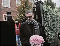  ??  ?? In this Friday, Dec 23, 2011 file photo, British singer George Michael leaves his house in north London, after recovering from a life-threatenin­g bout with pneumonia that kept him in a Vienna hospital for a month.