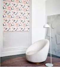  ??  ?? DOODLE JAFFA
WITH ITS STRIKING ORANGE, BLACK AND WHITE SWIRLS, the Doodle Jaffa print roller blind is colourful and quirky, adding a touch of modern charm to any living room.