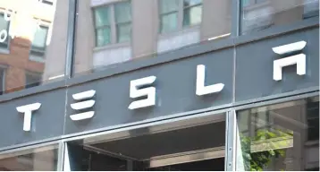  ??  ?? The Tesla logo is seen outside of their showroom in Washington, DC. A Wall Street Journal story published after the stock market closed said the subpoena sought informatio­n from each of Tesla’s directors. — AFP photo