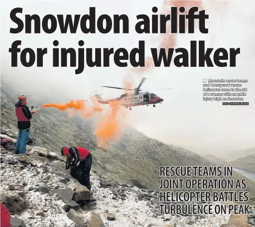  ??  ?? ■ Mountain rescue teams and Coastguard rescue helicopter come to the aid of a woman with an ankle injury high on Snowdon