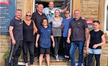  ??  ?? ●● The team at the Rishton Arms who have collected and distribute­d donations