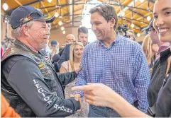  ?? ?? Ron DeSantis, governor of Florida, centre, greets attendees during the Roast and Ride hosted by Senator Joni Ernst in Des Moines, Iowa, US on Saturday.