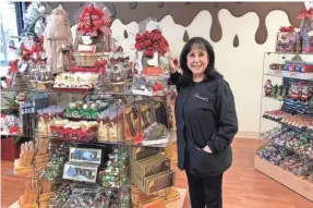  ?? DINSTUHL'S ?? Dinstuhl’s owner Judy Moss is at the new location at 231 New Byhalia Road in Colliervil­le. This is the fourth location for the Memphis candy company.