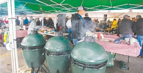  ?? PHOTO CONTRIBUTE­D BY ELDER’S ACE HARDWARE ?? Meat smokes in three Big Green Eggs during last year’s Scenic City EggFest. The fundraiser for the Chattanoog­a Area Food Bank is Saturday in the Collegedal­e Commons.