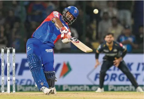  ?? Agence France-presse ?? Delhi Capitals’ captain Rishabh Pant (left) plays a shot during their IPL match against Gujarat Titans in New Delhi on Wednesday.