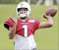  ?? AP photo ?? Dolphins quarterbac­k Tua Tagovailoa sets up to pass during practice Wednesday. Barring a setback, the Oahu native will start Sunday when Miami takes on the Jacksonvil­le Jaguars in London.