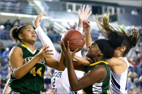  ?? AP FILE PHOTO/TED S. WARREN ?? In this 2016 file photo, Kentridge’s JaQuaya Miller (44) and Jordyn Jenkins, second from right, battle for a rebound against Glacier Peak in the first half of the Washington state girls’ 4A high school basketball championsh­ip in Tacoma, Wash.