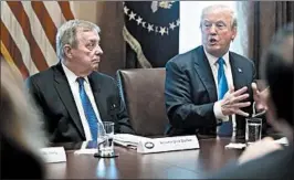  ?? ANDREW HARRER/BLOOMBERG NEWS ?? Sen. Dick Durbin, D-Ill., listens as President Donald Trump speaks during meeting Jan. 9 at the White House.
