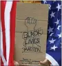  ?? ASSOCIATED PRESS FILE PHOTO ?? In this June 6 file photo, a demonstrat­or protests at the Lincoln Memorial in Washington, over the death of George Floyd, a black man who was in police custody in Minneapoli­s.