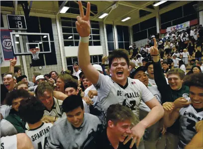  ?? JOSE CARLOS FAJARDO — BAY AREA NEWS GROUP, FILE ?? De La Salle’s Noah Clifford (42) celebrates with his teammates after defeating Granada High during the 2020 NCS D-I boys basketball final.