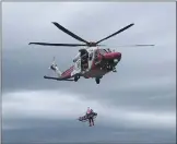  ??  ?? Left, A casualty with facial injuries and a suspected broken arm is helicopter­ed to hospital by Rescue 199.