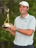  ?? Richard Heathcote / Getty Images ?? No. 1-ranked golfer Scottie Scheffler won The Players Championsh­iip for his sixth title in the last 13 months.