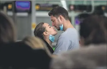  ?? Emilio Morenatti Associated Press ?? TRAVELERS at Barcelona’s airport on Thursday. Spain is among the 26 European countries affected by President Trump’s sweeping travel restrictio­ns, which were issued without consultati­on with European leaders.