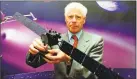  ?? Matthew Fearn / Associated Press ?? Roger Bonnet, of the European Space Agency, holds a model of the Rosetta spacecraft.
