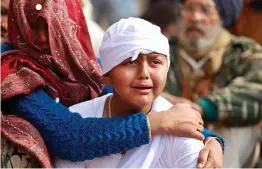  ?? — AP ?? Son of Gopal Dass, a civilian killed in Pakistani firing and shelling, wails at Jhiri village in Kanachack district of Jammu and Kashmir on Monday.