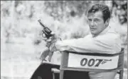  ?? AP FILE ?? Roger Moore, playing the title role of secret service agent James Bond, at the sets of Live and Let Die in 1972.