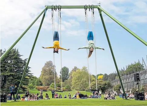  ??  ?? Two aerialists wow the crowds in The Swings, a performanc­e and sound installati­on.