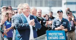  ?? NATHAN DENETTE THE CANADIAN PRESS ?? Ontario premier-designate Doug Ford announces his commitment to keeping the Pickering Nuclear Generating Station in operation until 2024 in Pickering.