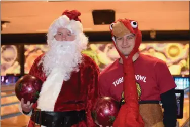  ?? MARIAN DENNIS — DIGITAL FIRST MEDIA ?? Guests including Santa Claus and a Thanksgivi­ng turkey made an appearance Thursday during the annual Turkey Bowl in Limerick.