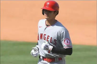  ?? Tribune News Service/getty Images ?? Shohei Ohtani #17 of the Los Angeles Angels walks back to the dugout after flying out in the sixth inning against the Los Angeles Dodgers at Dodger Stadium on September 27, 2020 in Los Angeles.