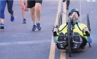  ?? GREG SORBER/JOURNAL ?? Matthew Walworth of Centennial, Colo., won the wheelchair division of the Duke City Marathon. He ran in the 2004 Duke City, his last marathon as a runner before suffering a neurologic­al disorder.