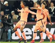  ?? AP ?? Liverpool’s Joel Matip (left) celebrates scoring his side’s second goal during the English Premier League match against West Ham at the London Stadium yesterday.