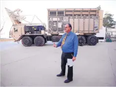  ?? ADOLPHE PIERRE-LOUIS/JOURNAL ?? AFRL High Power Microwave technologi­es branch chief Stephen Langdon shows the MaxPower System, an armored vehicle that shoots blasts of electromag­netic power to detonate improvised explosive devices.