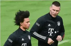  ?? — AFP ?? Top mission: Bayern Munich’s Leroy Sane (left) and Niklas Suele are aiming to return to top form after their knee injuries.