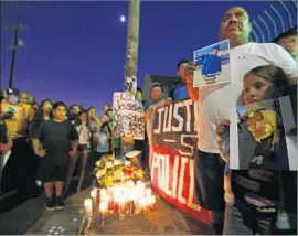  ?? Luis Sinco Los Angeles Times ?? BOYLE HEIGHTS residents protest the killing of Jesse Romero in August by an LAPD officer. It was the officer’s second fatal shooting in less than two weeks.