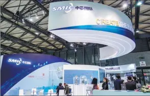  ?? PROVIDED TO CHINA DAILY ?? The booth of Semiconduc­tor Manufactur­ing Internatio­nal Corp during an industry expo in Shanghai.