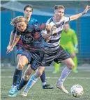  ?? ?? Caledonian Braves’ Jamie Walker (left) gets to grips with Rutherglen’s Jack McIlveen