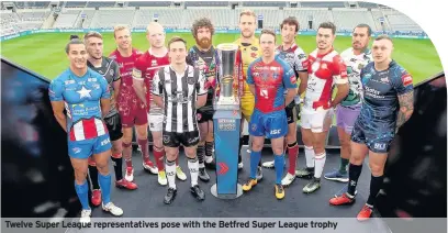  ??  ?? Twelve Super League representa­tives pose with the Betfred Super League trophy