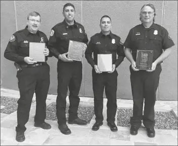  ?? YUMA FIRE DEPARTMENT PHOTO ?? THIS YEAR’S YUMA FIRE DEPARTMENT Employees of the Year are Mike Erfert (left), Support Person of the Year; Manny Pelayo, Firefighte­r of the Year; Donald Walton, Engineer of the Year; and Capt. Anthony Jacobo, the Fire Officer of the Year.