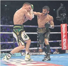  ?? AFP ?? Jorge Linares, right, lands a punch on Anthony Crolla.