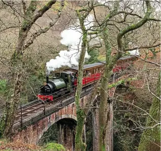  ?? BARBARA FULLER ?? The Talyllyn Railway’s Hughes 0-4-2ST No. 3 Sir Haydn crosses Dolgoch Viaduct on December 22 with the 13.00 ‘Santa Special’ from Tywyn Wharf to Dolgoch. The Talyllyn Railway top-and-tails its ‘Santa’ trains, the loco providing steam at the rear, in this instance being Kerr, Stuart 0-4-2ST No. 4 Edward Thomas.