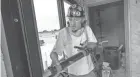  ?? MARK HOFFMAN / MILWAUKEE JOURNAL SENTINEL ?? Glazier Chris Zehring works on a guardhouse at the 128th Air Refueling Wing at 1919 E. Grange Ave. in Milwaukee.