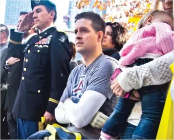  ?? AP FILE ?? Former U.S. Air Force veteran and Iraq War double amputee Brian Kolfage (center), a co-founder of the “We Build The Wall” project aimed at raising money for a border wall, pleaded guilty Thursday to charges in a case that once included former President Donald Trump’s adviser Steve Bannon.