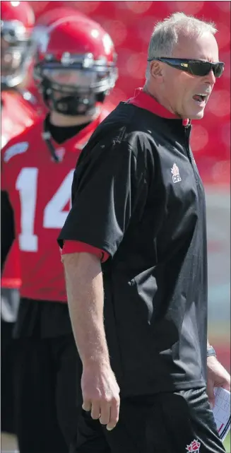  ?? Ted Rhodes, Calgary Herald ?? Stamps coach John Hufnagel gives players a piece of his mind following a miscue at practice Thursday.