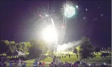  ?? Westside Eagle Observer/MIKE ECKELS ?? Veterans, Edmiston and McCollum parks are illuminate­d by a series of brightly-colored fireworks as the display marks the conclusion of the 68th Decatur Barbecue in Decatur on Aug. 6.