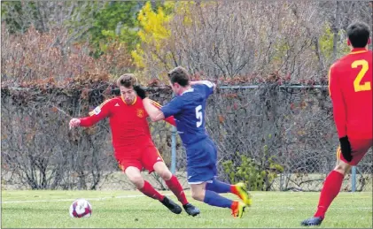  ?? LEE KORMISH PHOTO/SASKATCHEW­AN SOCCER ?? Issac Bonisteel of Holy Cross/kirby Group tries to maneuver past Saskatchew­an’s Mitchell Bauche, who is coming in for a tackle, during play in the bronzemeda­l game at the national Challenge Cup men’s soccer championsh­ip Monday in Saskatoon.
