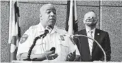  ?? AMY DAVIS/BALTIMORE SUN ?? Police Commission­er Michael Harrison, left, is seeking changes that would allow the police commission­er to fire officers charged with felonies and misdemeano­rs, instead of having to wait until they are convicted.