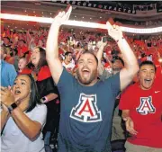  ?? [AP PHOTO] ?? Fans Josie Velasco, Michael Velasco, Angel Velasco and Susan Velasco, from left, cheer in Phoenix as the Suns selected Deandre Ayton with the first pick in the NBA Draft on Thursday.