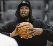  ?? NATHAN DENETTE / THE CANADIAN PRESS ?? Golden State Warriors Kevin Durant watches during basketball practice at the NBA Finals in Toronto on June 1. He has been out for more than a month with a strained calf.