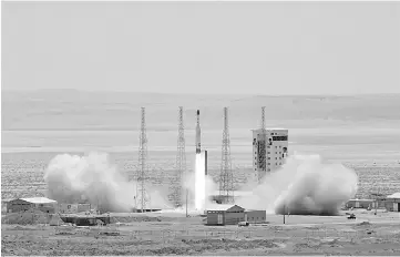  ??  ?? File photo shows a Simorgh satellite rocket at its launch site at an undisclose­d location in Iran. — AFP photo