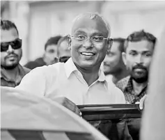  ?? Reuters photo ?? Solih arrives at an event with supporters in Male.—